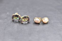 A pair of 15k yellow metal and alexandrite type earrings, the oval stones claw set, marked 14k to