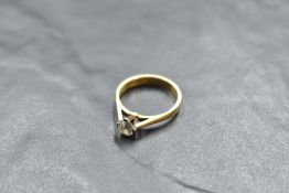 A diamond solitaire ring, approx 0.5ct in a four claw setting to knife blade shoulders on an 18ct