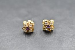 A pair of 9ct gold stud earrings having amethyst and cubic zirconia cross detail, approx 3g