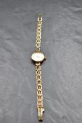 A 9ct gold wrist watch by Empress having baton numeral dial to small circular face with a 9ct gold