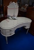 A Louis IV style kidney shaped laminate dressing table