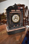A Victorian black slate mantel clock
