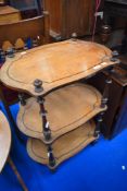 A 19th Century three tier whatnot/etage having mahogany turned supports
