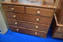 A Victorian stripped pine chest of two over three drawers