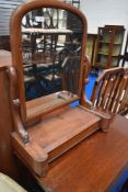 A Victorian mahogany toilet mirror having lift lid to base