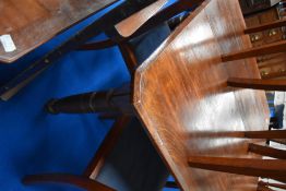 A Victorian style wind out dining table