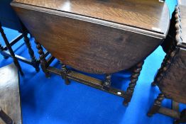A 1940's barley-twist oak gate-legged table, of traditional form 74cm x 87cm