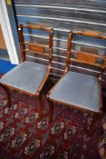 A pair of reproduction Regency yew effect dining chairs
