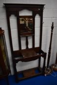 A late 19th or early 20th Century oak hall stand