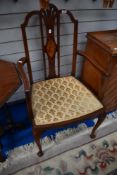 An Edwardian mahogany carver chair