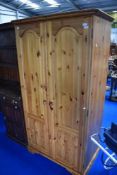 A modern Ducal style pine wardrobe