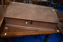A stained pine work box having sloped top