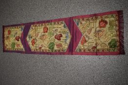 A Mid century 'Rev-Robe' suitcase and a vintage table runner, having oriental styling on pink ground