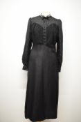 A 1930s black day dress, having contrasting crepe blouson bodice, full length sleeves gathering into
