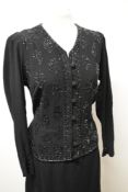 A late 1930s/40s black crepe dress, having extensive beadwork to bodice, self covered buttons to