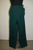 A pair of ladies 1940s/1950s bottle green high waisted Western slacks or trousers, with press