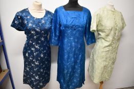 Three 1950s and 1960s dresses, all having oriental influence, medium sizes.