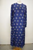 An Art Deco blue crepe day dress with fabulous shell like print in white , red and pale duck egg