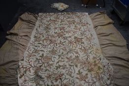 An antique Crewel work bed covering with valanced edge and a bright Crewel work table runner.