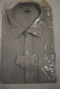 A 1950s 'Radiac' gents collarless shirt, in green and brown fine check, as new, in packaging, with