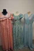Three vintage maxi dresses, including 1970s floral dress with ruffled collar.