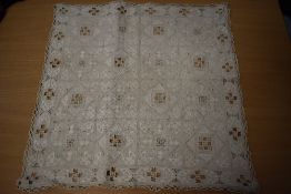 A section of antique cut linen with plaited lace edge.