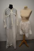 A Victorian nightdress having panels of lace to bodice and a pair of bloomers with frilled edging,