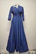 A 1940s blue evening gown, having sequins to bodice, v neckline and wrap around bust which ties