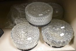 A variety of vintage moulded glass centre ceiling light shades.