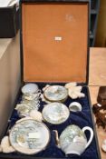 An early 20th century cased Chinese/Japanese porcelain tea set decorated with birds and blossoms