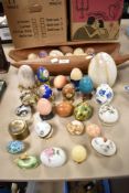 A mid century carved wood bowl with enclosed design and a selection of semi precious stone turned