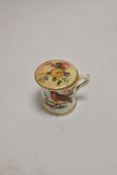 A miniature Royal Worcester hand painted cup, decorated with a robin, and a Royal Worcester blush
