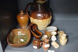 A 19th Century stoneware jug, in the manner of Doulton, with relief moulded decoration, together