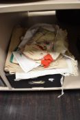 A collection of vintage table cloths, embroidered doilies, crinoline lady design tea cosy, etc