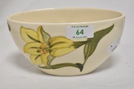 A William Moorcroft Daffodil design vase, with marks to base, measuring 9cm tall
