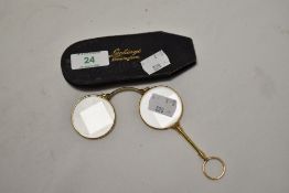 A pair of yellow metal lorgnettes within a Luckings of Birmingham leather case