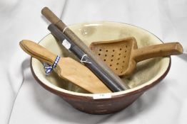 A 19th Century earthenware bowl together with butter pats, and other items