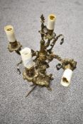 A cast metal four branch table lamp in the form of an antique candleabra, having gilt finish.