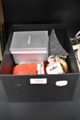 An assorted collection of costume jewellery, a wide brass metal bangle, and a DKNY ladies