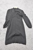 A 1930s/ 1940s textured day dress in black, having wide sleeves gathering into a fitted cuff,