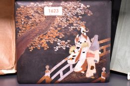 A vintage lacquered box, having bridge and tree scene, minus escutcheon, also included are a few