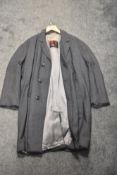 A gents single breasted 1960s coat, having Breakwater shower proof Burton label.