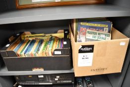 Two cartons of books and magazines containing approximately 35 vintage ladybird books and a