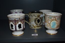 Five Wedgwood and Coalport commemorative mugs and goblets, including three limited edition