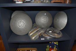An assorted collection of hub cap covers, including versions by VW, plus bumper guards