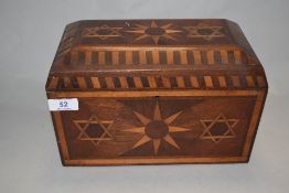 A 19th Century marquetry inlaid jewellery box, decorated with Eastern motifs, and having a fitted