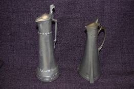 Two cast pewter lidded ewers, of Art Nouveau/ Jugendstil design, one marked Bingit Zinn GBN to the