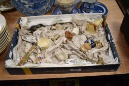 A miscellany of vintage and antique trinkets, including glass perfume bottle with floral decoration,