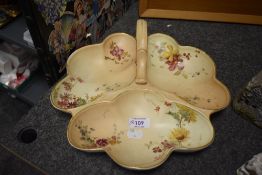 A Royal Worcester blush ivory serving dish, having three compartments and handles, dated to 1897.
