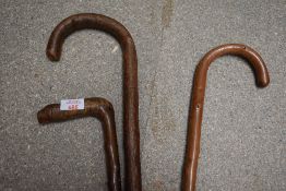 3 wooden walking sticks with curved handles